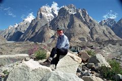 18 Jerome Ryan Poses Above Lake On Baltoro Glacier With Great Trango Tower And Trango Castle Behind.jpg